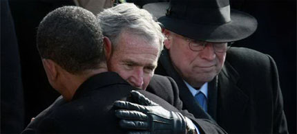Presidents Obama and Bush embrace on Inauguration Day as Vice President Cheney looks on, 01/20/09. (photo: Justin Sullivan/Getty Images)